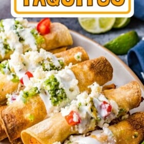 Air fryer taquitos on a plate with toppings: sour cream, pico de Gallo and salsa.