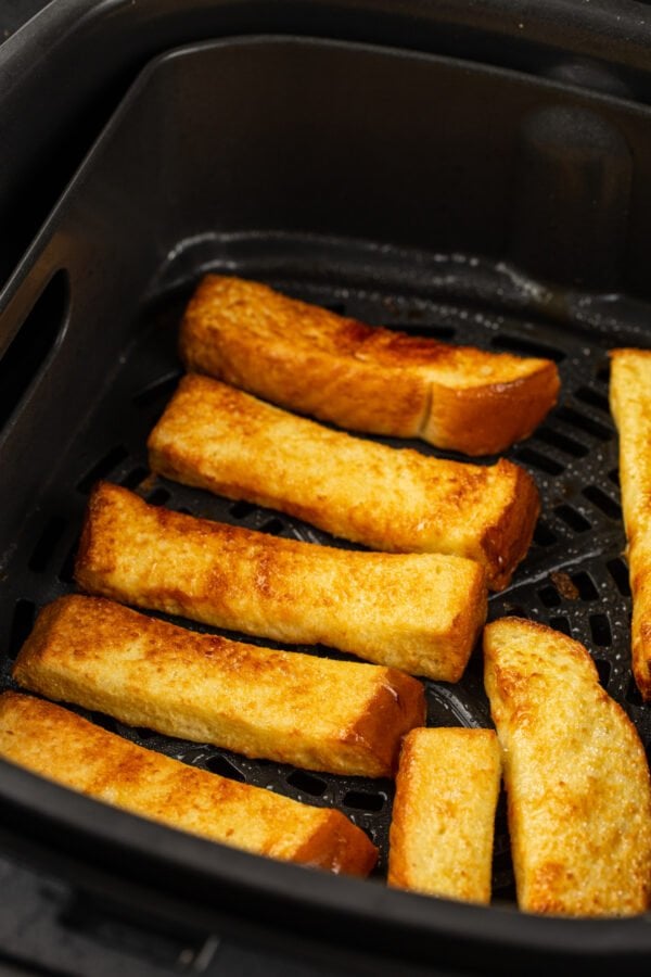 French toast sticks are browned and cooked in the air fryer.