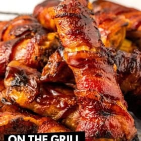 Close-up of crispy bacon-wrapped BBQ shotgun shells, showcasing a delicious grilled or air-fried appearance. The glossy, charred exterior highlights the savory flavors of the dish.