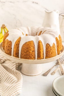 A banana bundt cake on a cake stand.