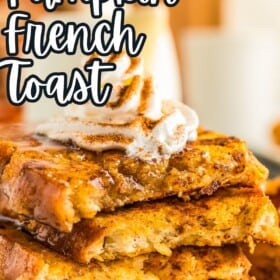 Whipped cream is piped on top of a stack of fluffy pumpkin French toast on a plate.