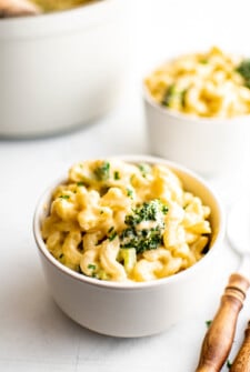 Serving macaroni and cheese in bowls.