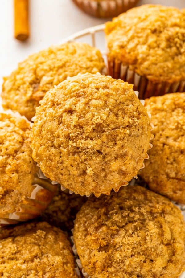 Made in one-bowl in just 25 minutes, these easy Brown Sugar Banana Muffins are extra moist with a caramelized brown sugar crunchy topping! Warm and moist, these easy banana muffins arranged in a basket glisten with a sweet and crackly brown sugar topping.