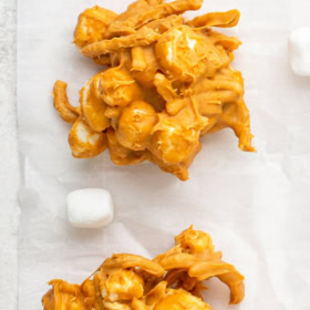 Two butterscotch haystacks on parchment paper.