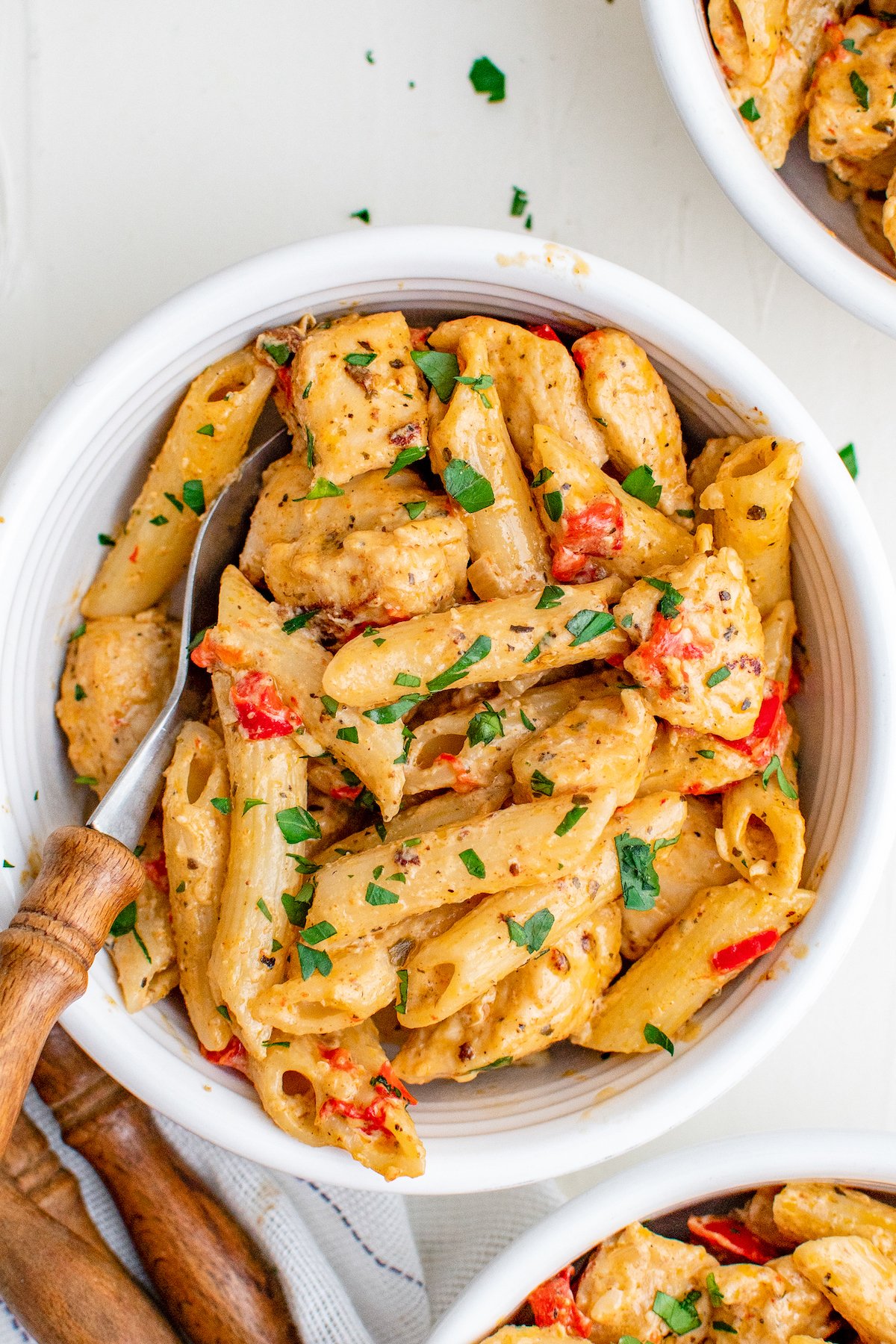 This flavorful and creamy Cajun Chicken Pasta recipe is one of our favorite restaurant style dishes to make at home in just 30 minutes! A bowl of creamy cajun chicken pasta with juicy and tender, well-seasoned chicken and penne pasta coated in a creamy cajun spiced sauce.