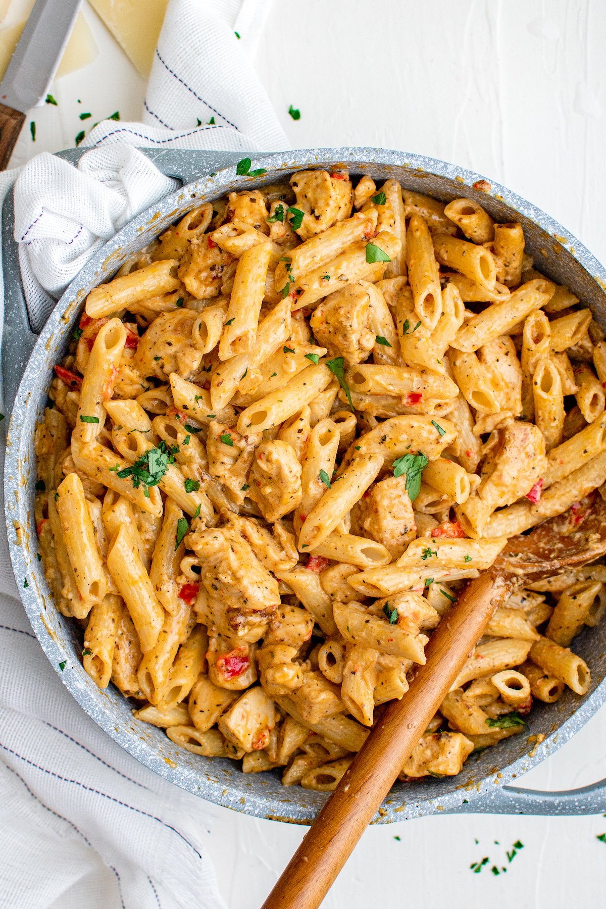 This flavorful and creamy Cajun Chicken Pasta recipe is one of our favorite restaurant style dishes to make at home in just 30 minutes! A skillet of Cajun pasta with tender, seasoned chicken and penne pasta in a lusciously creamy sauce.