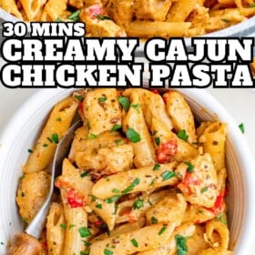 A bowl of Cajun chicken pasta topped with fresh herbs with a fork on the side.