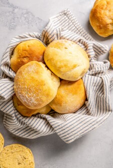 Cemitas in a bread basket lined with cloth.