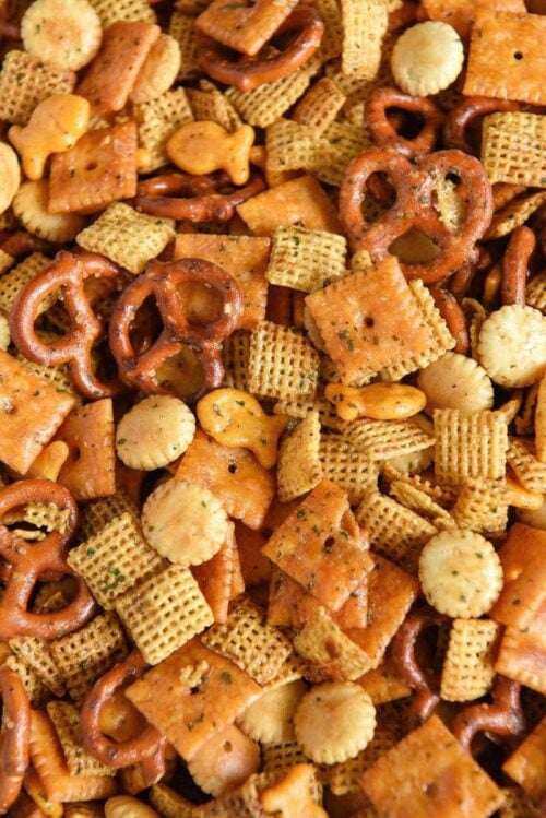 Close-up of the chex mix snack with cayenne pepper, ranch mix, Worcestershire sauce, and brown sugar.