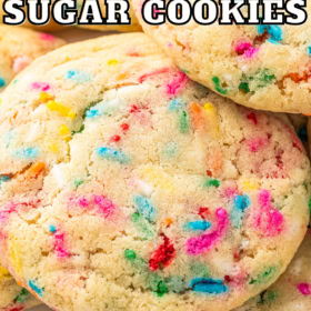 Soft sugar cookies with sprinkles stacked on top of each other.