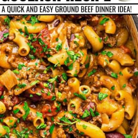 Easy American goulash recipe served with fresh herbs on top in a large pot.