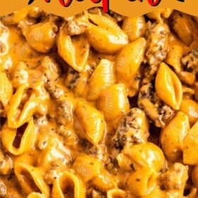 Homemade Hamburger Helper in a skillet with ground beef and cheddar cheese.