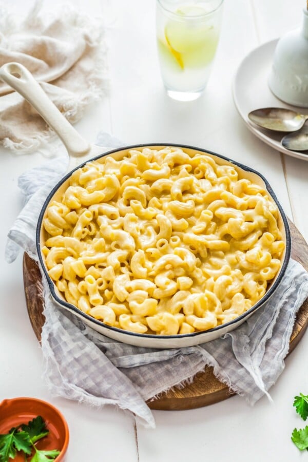 This easy, one-pot homemade mac and cheese recipe is made extra creamy with three types of cheese! Bonus: It's ready in under 20 minutes. Creamy homemade macaroni and cheese is in a skillet.