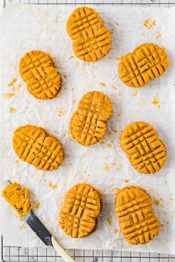 A sheet pan with Nutter Butter cookies sandwiched together with peanut butter filling.