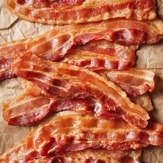 crispy bacon cooked in the oven on parchment paper