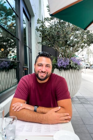 Jorge Segarra sitting at an outside table at a restaurant.