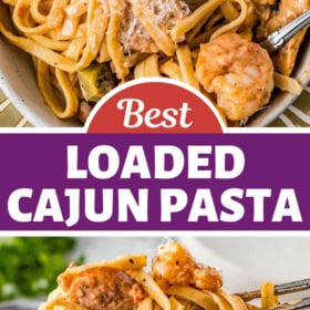 A bowl of chicken, sausage and shrimp pasta in a bowl and serving spoons scooping up a serving.