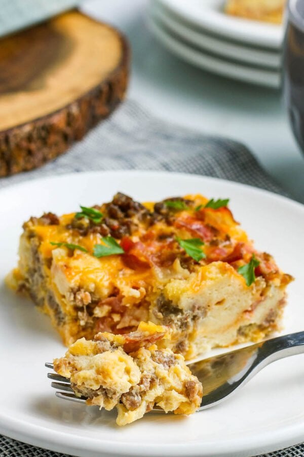 Overnight breakfast casserole served on a white plate.