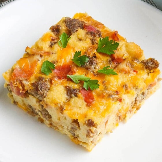 Overnight breakfast casserole served on a white plate.