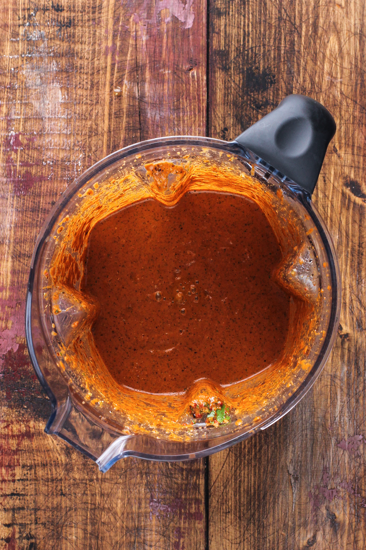 This juicy Mexican pollo asado is tangy, sweet, and smoky. Loaded with orange juice and cumin, it's then grilled to tender perfection. Blending the marinade.