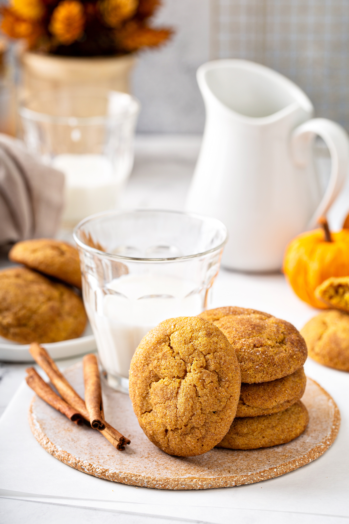 Pumpkin snickerdoodles, coated in sweet cinnamon sugar, are the perfect cookie recipe for fall! These easy pumpkin cookies are so addicting! Pumpkin snickerdoodle cookies with cinnamon sugar.
