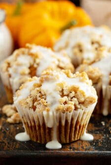 Pumpkin streusel muffin drizzled with cream cheese icing.