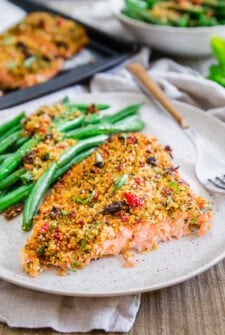 Plate of sun dried tomato parmesan crusted salmon.