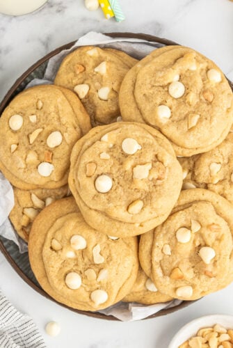 White chocolate macadamia nut cookies on a plate.