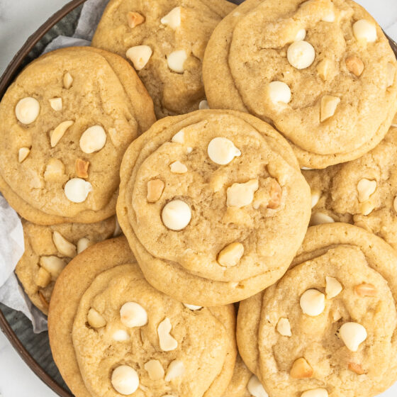 White chocolate macadamia nut cookies on a plate.